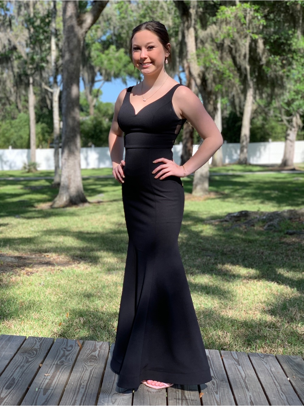 Stunning Black V-Neck Evening Gown with sheer back for Women. Size 0